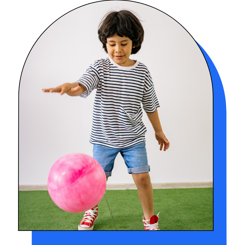 Child bouncing pink ball